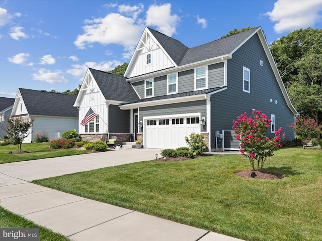 view of front facade with a front yard and a garage