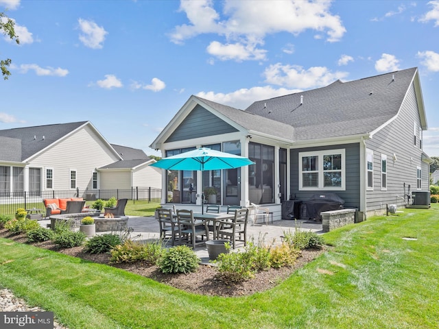 back of house with outdoor lounge area, a lawn, a patio area, and central AC