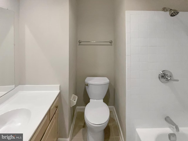 full bathroom featuring toilet, vanity, baseboards, and tub / shower combination