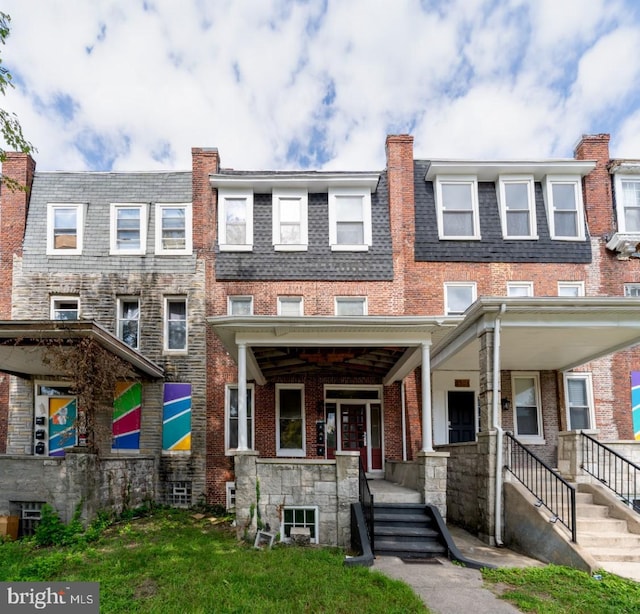 multi unit property featuring a porch