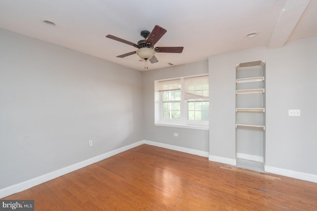 unfurnished bedroom featuring ceiling fan and hardwood / wood-style flooring