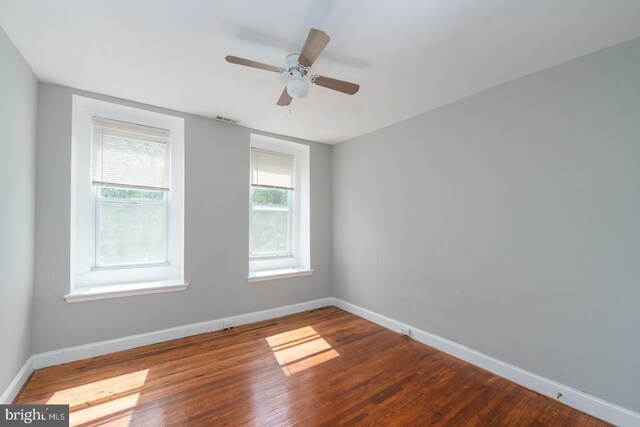 unfurnished room with wood-type flooring and ceiling fan