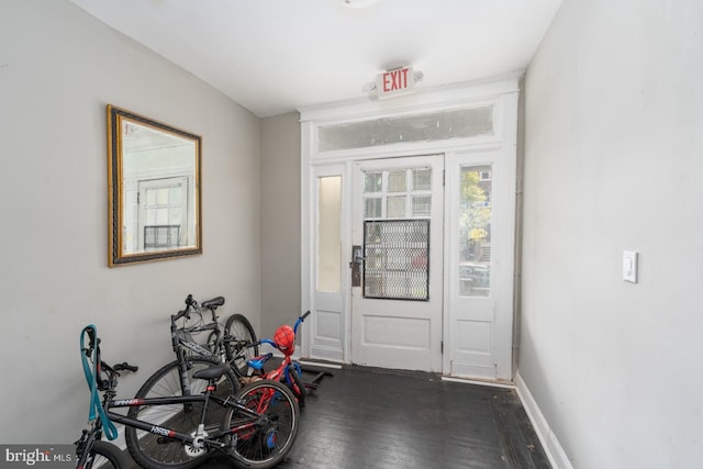 entryway with dark hardwood / wood-style floors