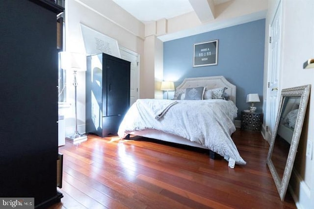 bedroom with hardwood / wood-style floors