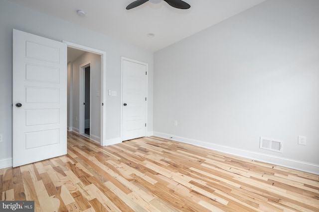 unfurnished room featuring ceiling fan and light hardwood / wood-style floors