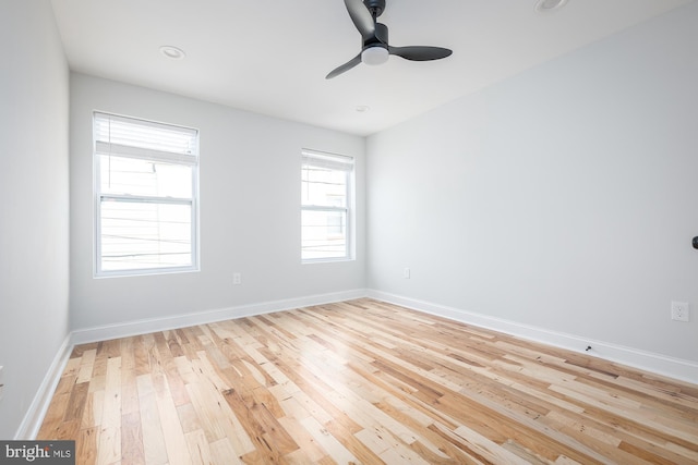 unfurnished room with ceiling fan and light hardwood / wood-style floors