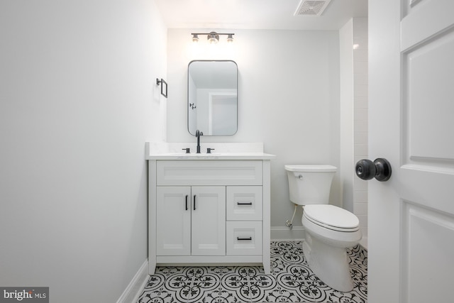 bathroom with tile patterned floors, toilet, and vanity