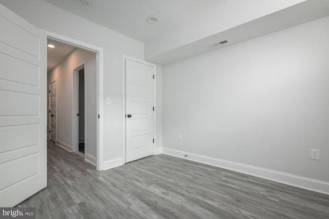 unfurnished room featuring wood-type flooring