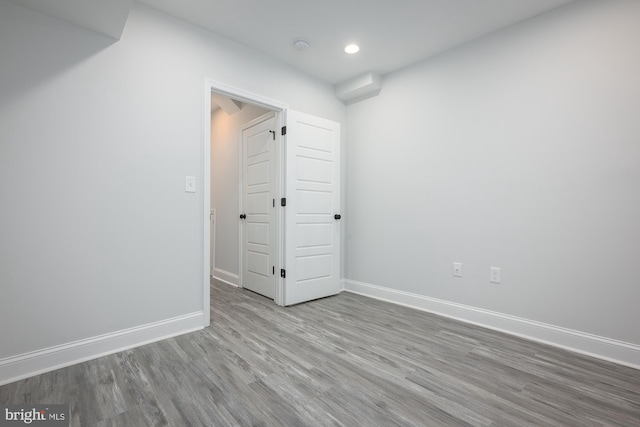 unfurnished room with light hardwood / wood-style floors