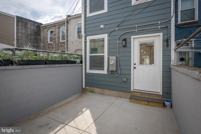 doorway to property with a patio