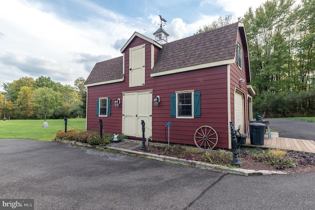 view of front of property with a garage and a front yard