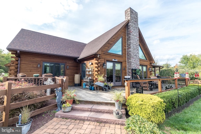 back of house featuring a wooden deck