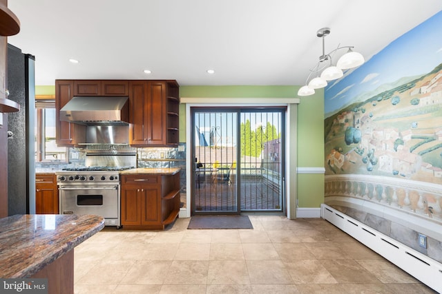 kitchen featuring dark stone countertops, pendant lighting, high end range, a baseboard heating unit, and extractor fan