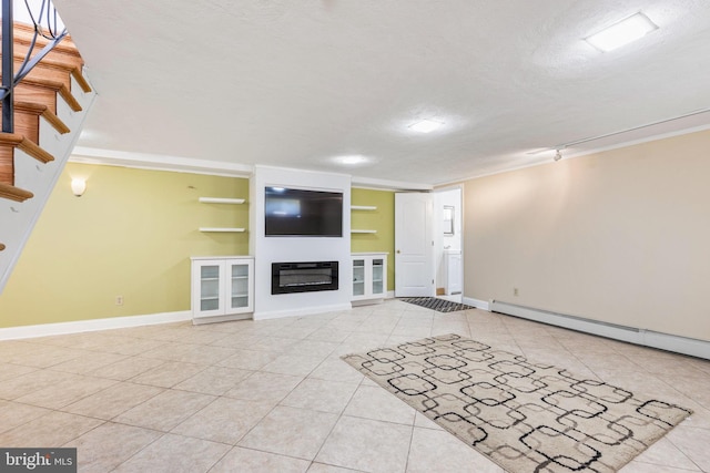 unfurnished living room with a textured ceiling and light tile patterned floors