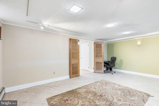 unfurnished office with light tile patterned floors, baseboard heating, and a textured ceiling