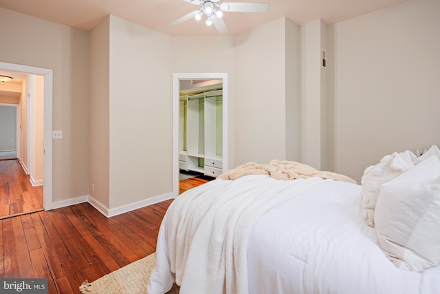 bedroom with a closet, ceiling fan, and hardwood / wood-style floors