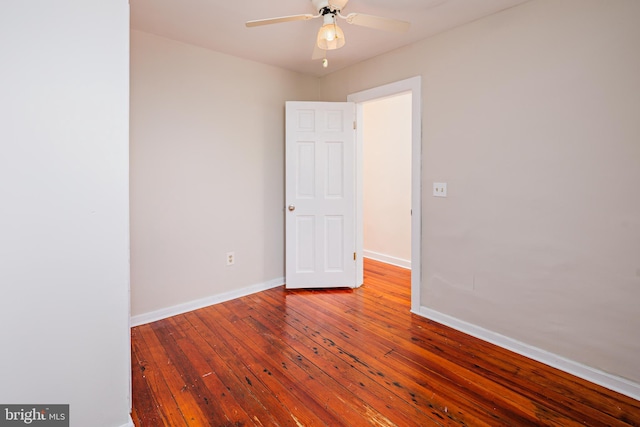 spare room with wood-type flooring and ceiling fan