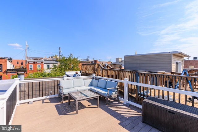 wooden deck featuring an outdoor living space