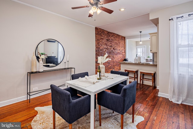 dining room featuring dark hardwood / wood-style flooring and ceiling fan