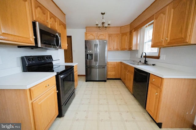 kitchen featuring black appliances, a chandelier, decorative light fixtures, and sink