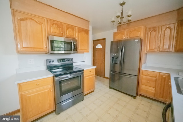 kitchen featuring a chandelier and stainless steel appliances