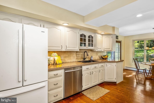 kitchen with white cabinetry, dark hardwood / wood-style flooring, stainless steel dishwasher, and white fridge