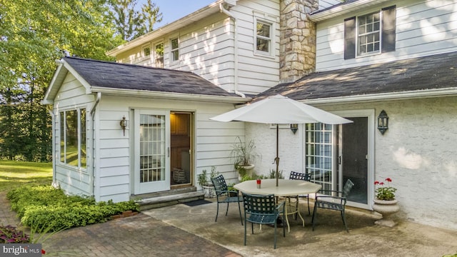 rear view of property featuring a patio