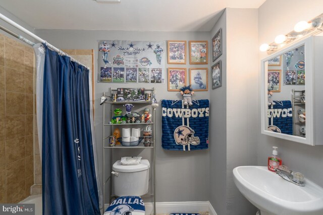 bathroom with toilet and sink