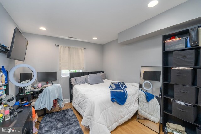 bedroom featuring wood-type flooring