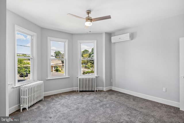 carpeted spare room with a wall mounted AC, ceiling fan, and radiator