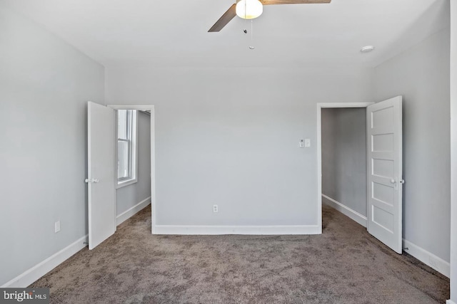 interior space featuring ceiling fan and carpet