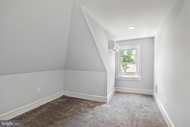 bonus room with lofted ceiling, carpet flooring, and a wall unit AC