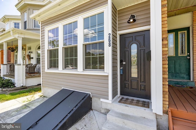 entrance to property featuring a porch