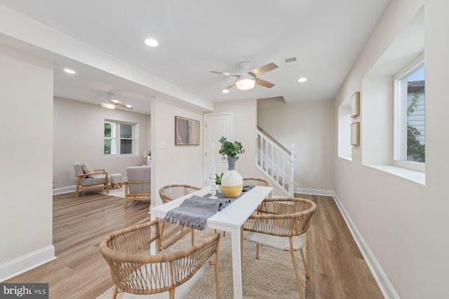 dining area featuring light wood-type flooring, ceiling fan, and a wealth of natural light