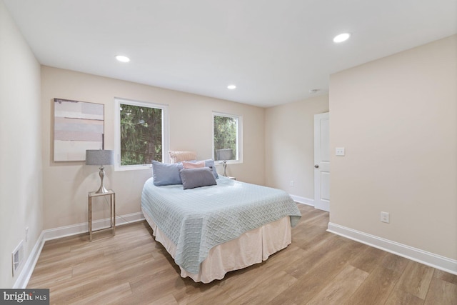 bedroom with light hardwood / wood-style flooring