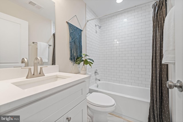 full bathroom featuring shower / bath combination with curtain, vanity, and toilet