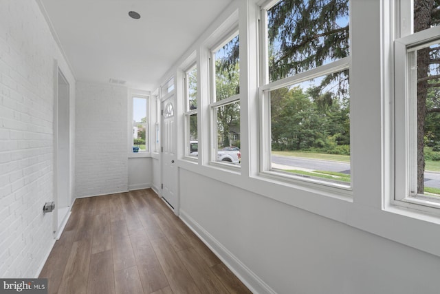 unfurnished sunroom with a wealth of natural light