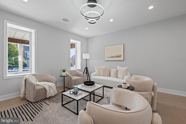 living room featuring light wood-type flooring and a wealth of natural light