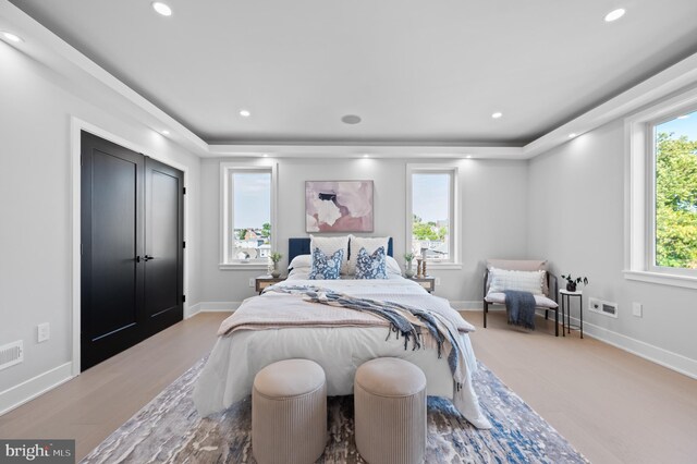 bedroom with light wood-type flooring