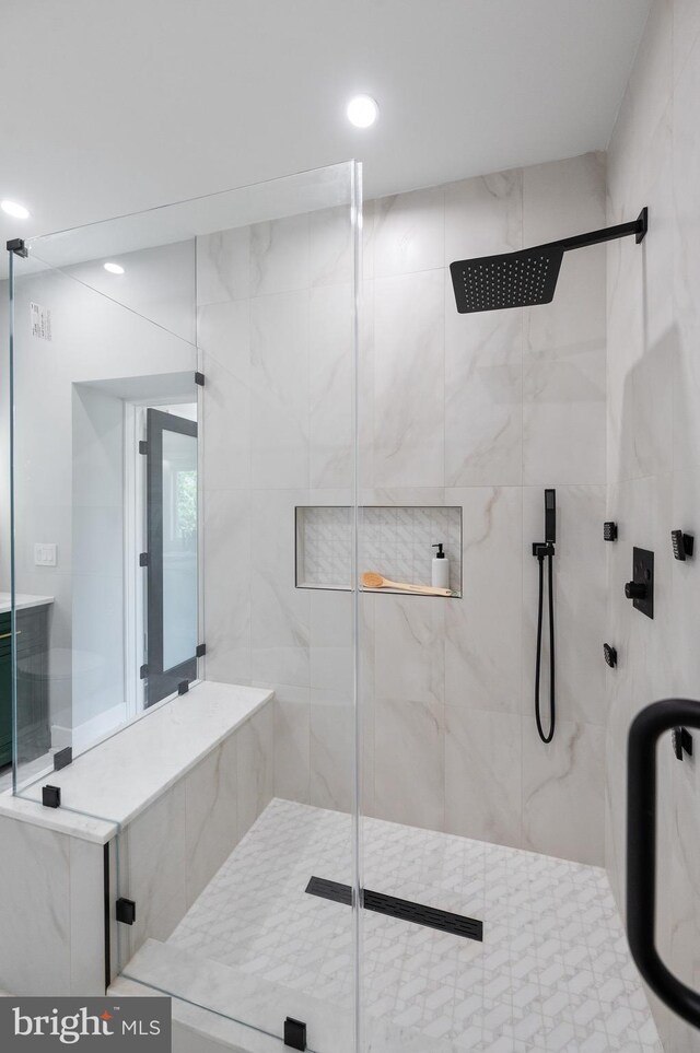 bathroom featuring an enclosed shower