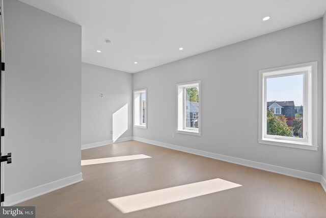 spare room featuring light wood-type flooring