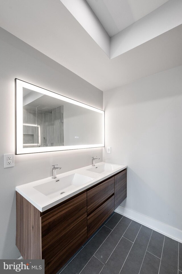 bathroom featuring vanity, an enclosed shower, and tile patterned floors