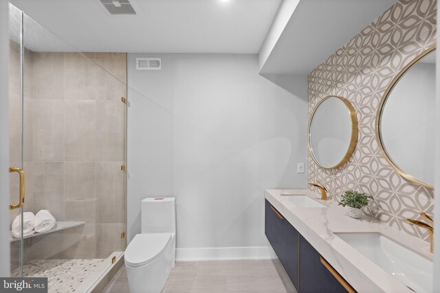 bathroom with vanity, toilet, walk in shower, and backsplash