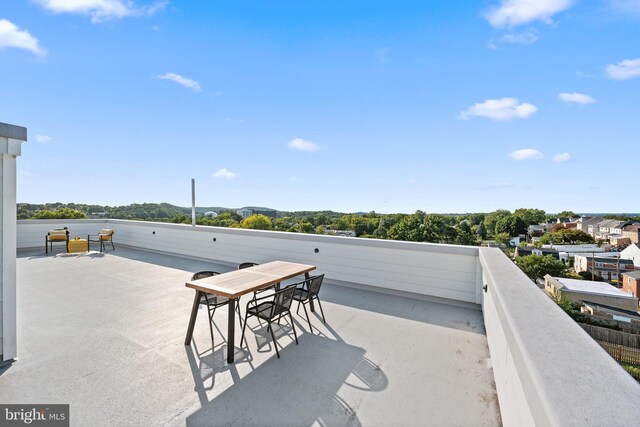 view of patio featuring a balcony