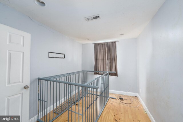 corridor featuring hardwood / wood-style flooring