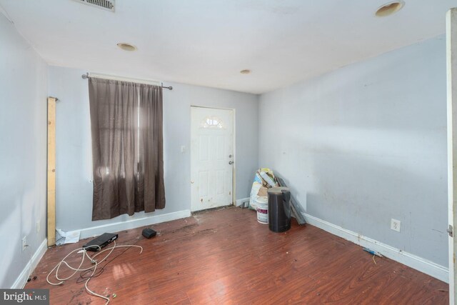 spare room with dark hardwood / wood-style flooring