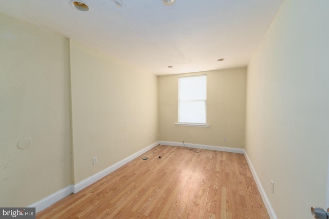 unfurnished room with light hardwood / wood-style floors