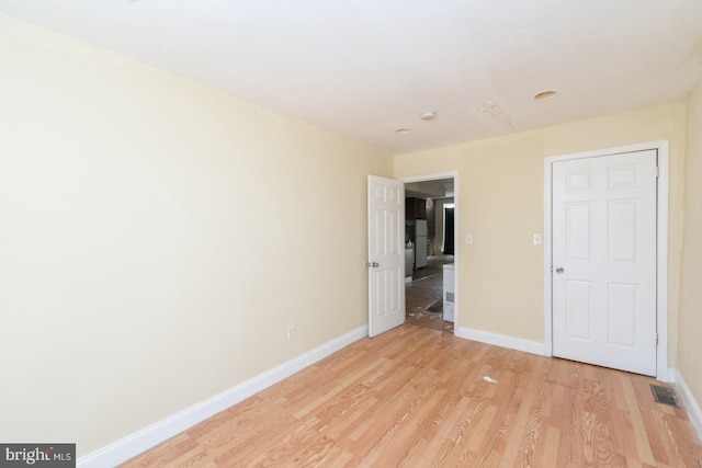 unfurnished bedroom with light hardwood / wood-style floors