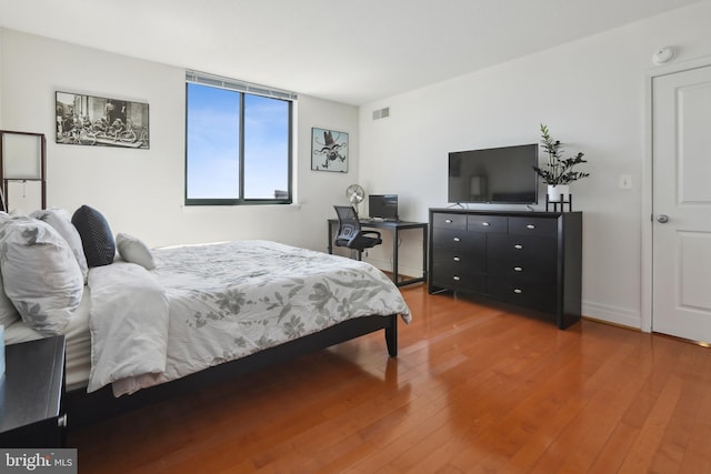 bedroom featuring wood-type flooring