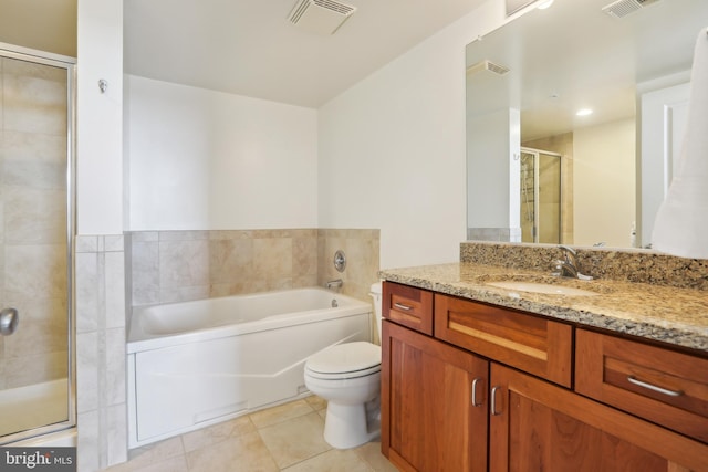 full bathroom with tile patterned floors, separate shower and tub, toilet, and vanity